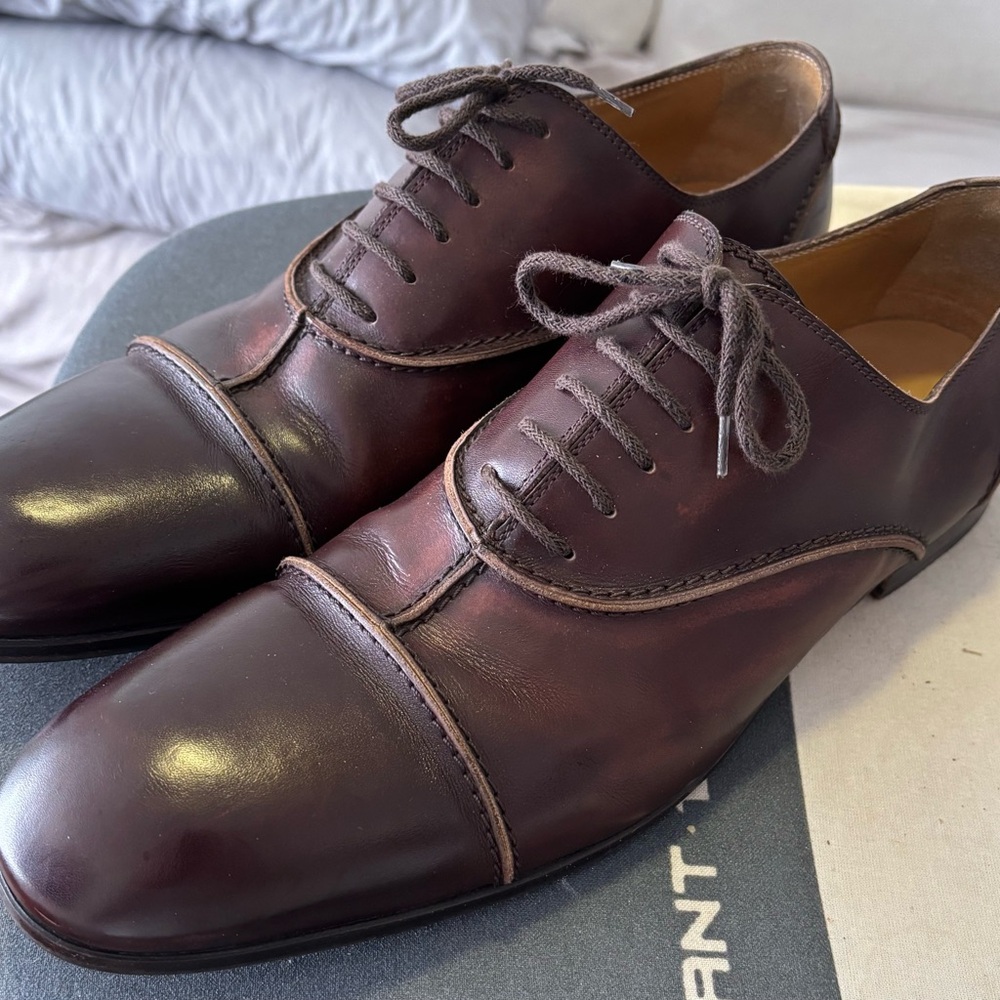 Yves Saint Laurent brown leather oxfords.
